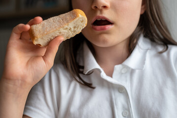 Child Eating Bread: Close-Up