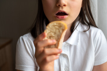 Child Eating Bread: Close-Up
