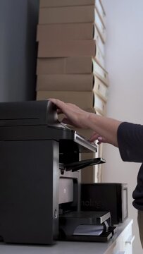 Woman Using Copy machine in Office, Office Worker Using Copy machine, Vertical Video