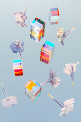 Beautiful flowers and glass geometric prism cubes with light diffraction of rainbow spectrum colors...