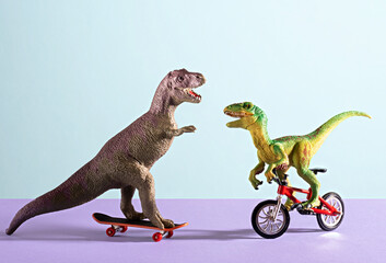 Obraz premium Two happy cute dinosaurs on bike and skate on blue and violet background.