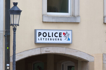 Police sign on a building facade in Luxembourg.