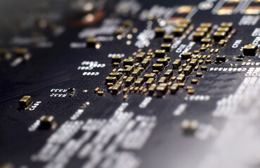 Motherboard chip panel with ICs, various zippers in a shallow depth of field that is sharp and...