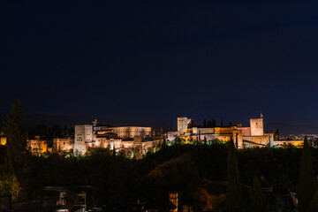 Panorama view of the Alhambra in Granada on a clear Spring night, a palace and fortress complex that remains one of the most famous monuments of Islamic architecture. - 747970786