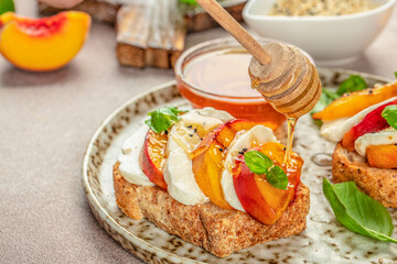 Healthy salad with fresh cheese and peaches on toast. Healthy food concept. place for text, top view