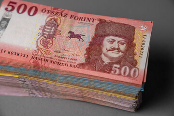 On a gray table is a stack of Hungarian paper money forint. Large denominations, Inflation and...