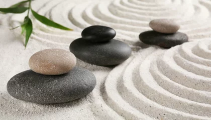 Fotobehang  Zen garden stones on white sand with pattern © wiizii