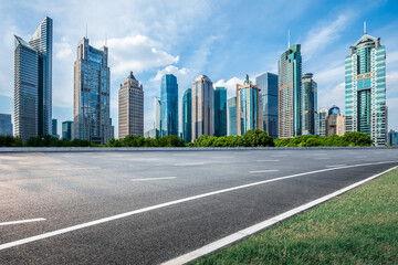 Asphalt highway road and modern city building scenery in Shanghai. Famous financial district...