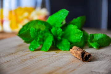 Mint with cinnamon on a wooden table