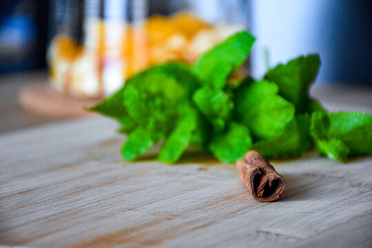 Mint with cinnamon on a wooden table