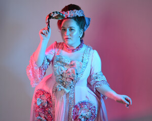  portrait of female model wearing an opulent pink gown,  costume of a historical French baroque...