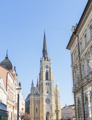 Fototapeta na wymiar Roman Catholic church in Novi Sad, Serbia, blending neo-Gothic architecture with historical charm, in the city center, inviting tourists to explore its cultural and religious significance .