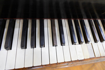 Vintage piano keys evoke timeless musical nostalgia. 
