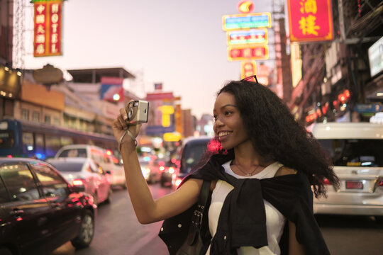 Asian woman enjoy travel in  downtown district