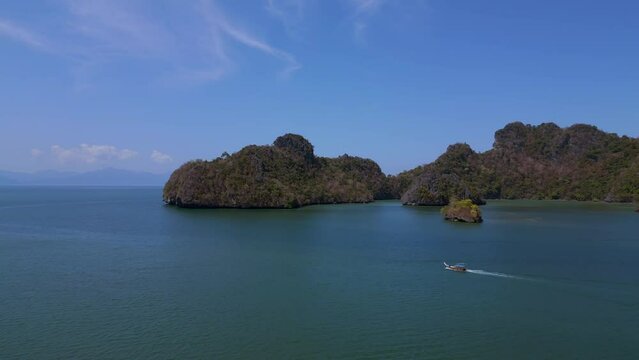 longtail boat Island at sandy beach malysia Langkawi. Magic aerial top view flight panorama overview drone
4k footage