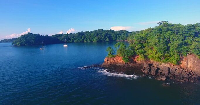 Tripod Aerial view of two sailboats anchored in a little cove in a beautiful paradise of archipelago in Central America near Panama