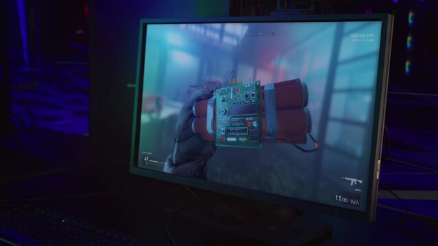 Starting a difficult mission in a modern warfare computer game. Attempting to defuse the bomb planted by the enemies in the computer game. Deactivating the bomb in the military computer game.