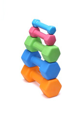 colorful rubber coated dumbbells isolated on white background