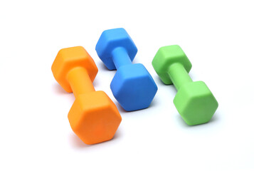 colorful rubber coated dumbbells isolated on white background