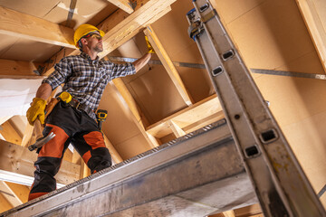 Construction Contractor Worker on a Scaffolding - 748004902