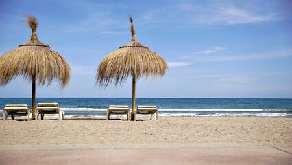 umbrellas and sunbeds on a deserted beach