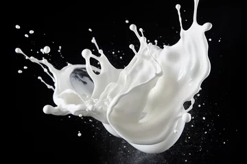  Image of white milk splash isolated on black background © Tommyview