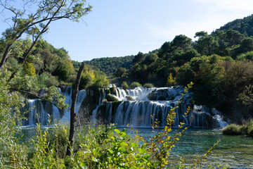 Krka National Park, Split, Croatia. Waterfall surrounded by green landscape and forest. Located in the region of Dalmatia. 