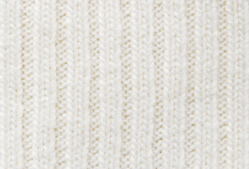 Soft white color chunky knit fabric pattern close up as background 