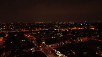 Naklejka premium aerial images of the nights in Bogota with its colors and its sky