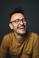 Happy middle-aged man in glasses enjoying a good laugh - 748011178