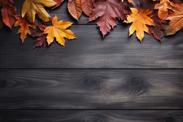 a group of colorful leaves on a wooden surface