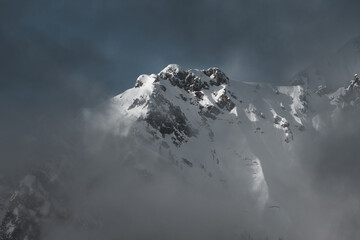 Snowy mountain in the clouds