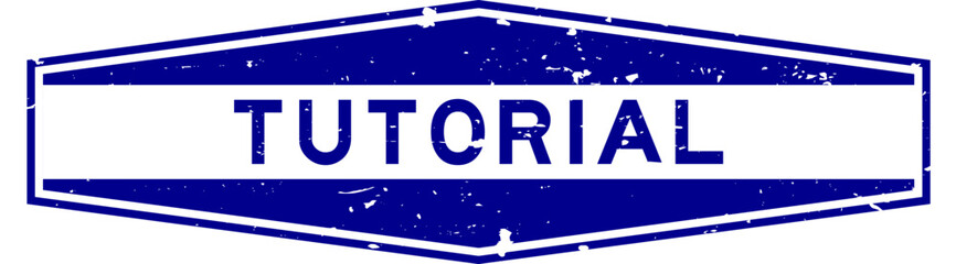 Grunge blue tutorial word hexagon rubber seal stamp on white background