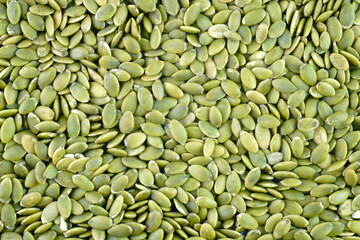 Macro background texture of green pumpkin seeds concept background