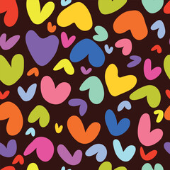 Colorful hearts on black background, seamless pattern. Vector