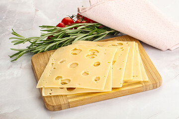 Sliced maasdam cheese with holes