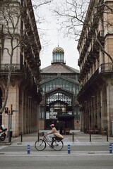 Fototapeta premium person riding a bicycle through Barcelona