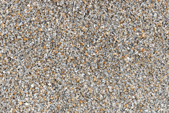 Rustic Charm: Sandwash Texture Background with Pebble and Gravel Inclusions
