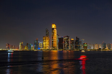 Amazing night city of Abu Dhabi. Cityscape by the water at night. Modern city