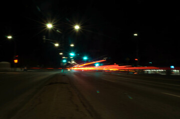 blurred car motion trails. Fast moving light effect, long exposure street night time photography in downtown area
