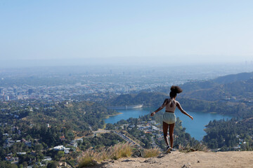 Fearless Fit African American Woman at the Edge of the Mountain of Hollywood Hiking, Los Angeles 