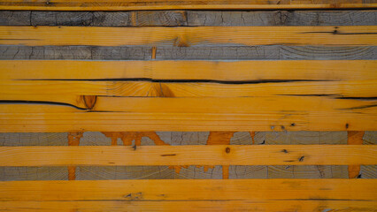 Abstract yellow orange painted colored rustic grain grunge wooden timber wall or floor or table...