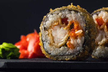 Sushi rolls Japanese food, set on a dark background