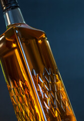 Whiskey bottle closeup on studio background