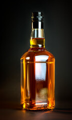 Whiskey bottke on dark studio background