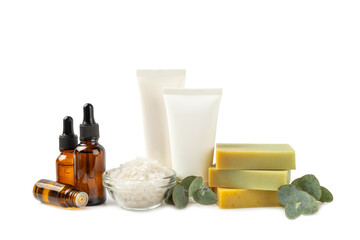Beautiful spa composition with eucalyptus leaves isolated on white background. Beauty and fashion spa concept with body cream, scrub, mask, essential oil and sea salt.Cosmetic product.