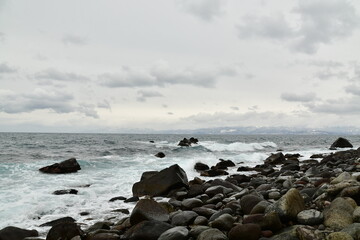 Fototapeta na wymiar Hokkaido Winter Coast Line near iwainai cloudy rough sea