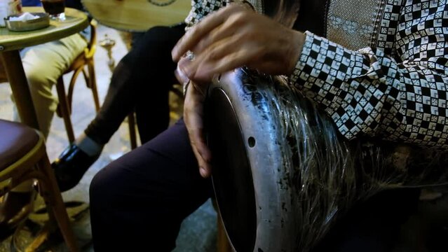 Hands of man playing darbuka. Man plays egyptian tabla drum. Chalice drum hand percussion