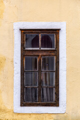 Detail from a wooden window of a historical building, classic architectural detail