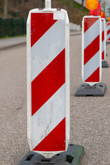 warning barrier on a road in front of a construction site